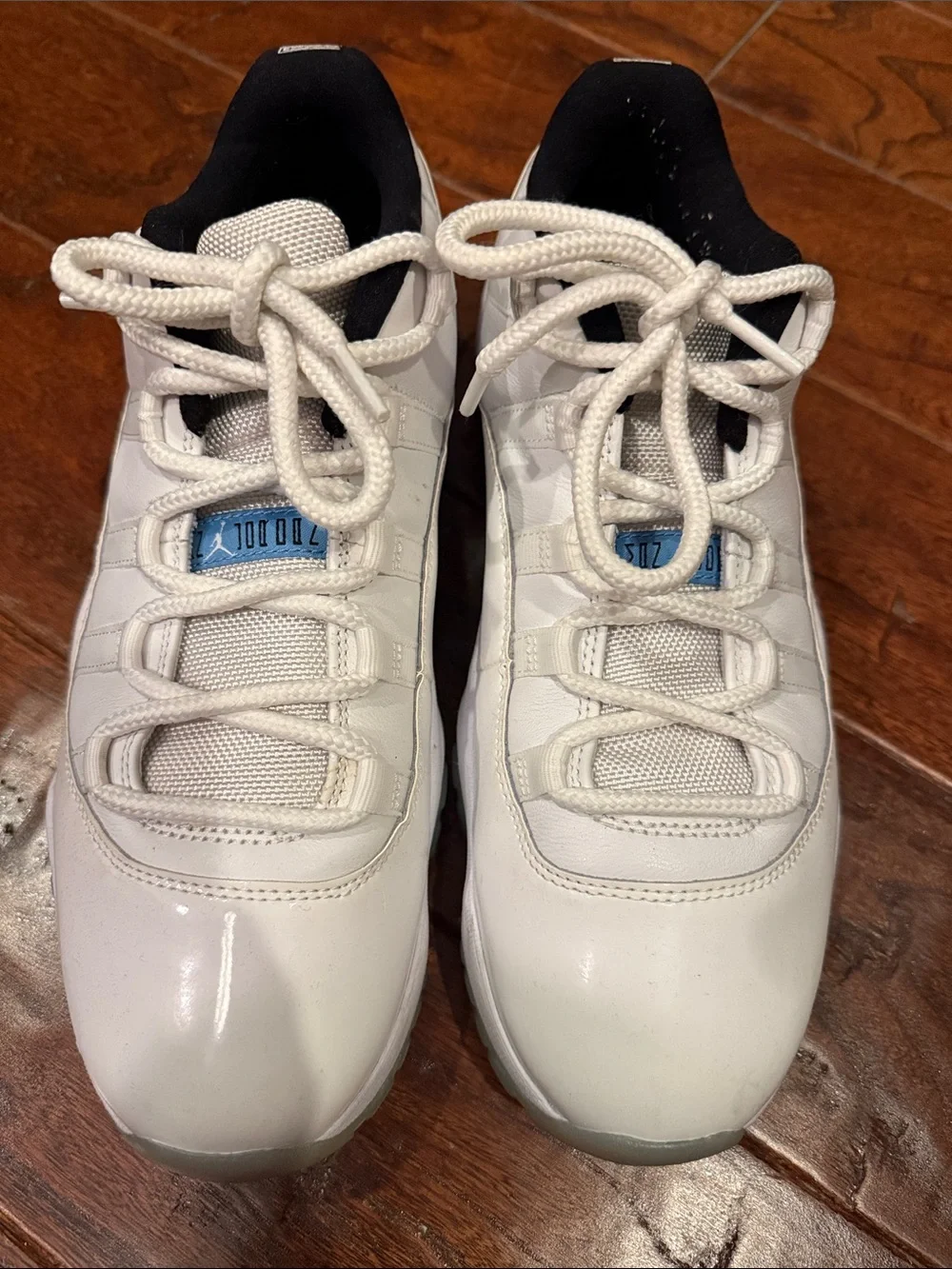 Jordan Men's White and Black Low-Top Sneakers with Blue Tongue Accent